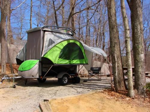Parked 5th wheel at site Ash Grove Mountain Cabins and Camping
