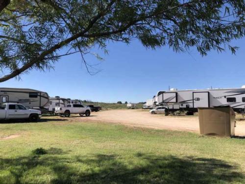 View of RVs from shade tree at Sand Creek RV Park
