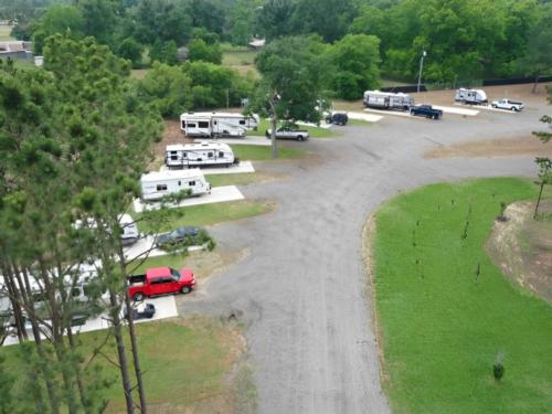 Parked trailers at site Sandy Pines RV Park
