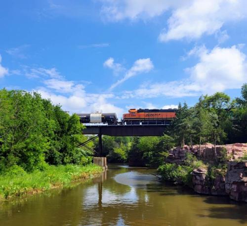 Train passing over lake at site Split Rock Park Campground