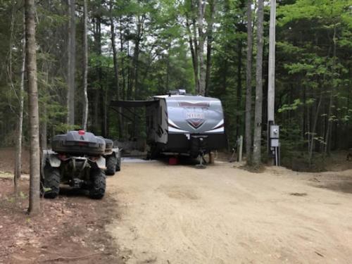 Parked trailer at site Coos Canyon Campground and Cabins