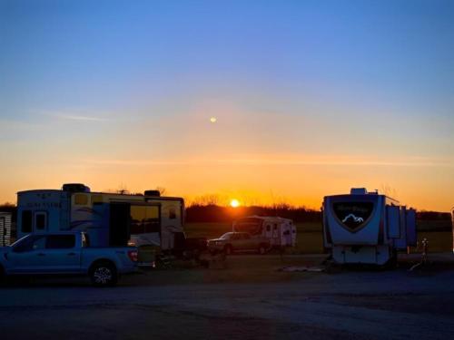 RVs in sites at sunset
