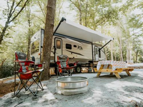 Fire pit with seating area at Ted & Tracy's RV Campground