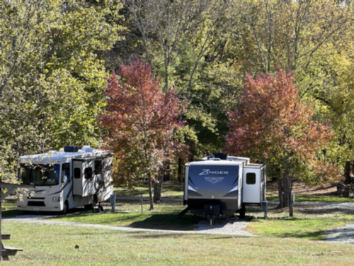 Two RVs parked by trees at The Resort at Boiling Springs
