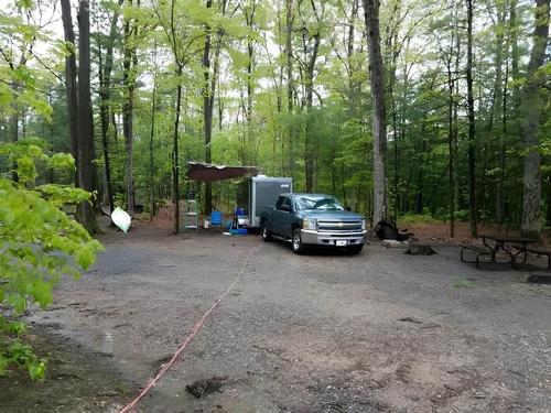 RV parked in a shady site