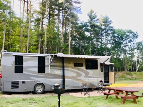 Parked RV at site Lone Mountain River Front Campground