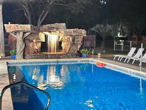 Pool with waterfall feature at Vacay Village of Pensacola