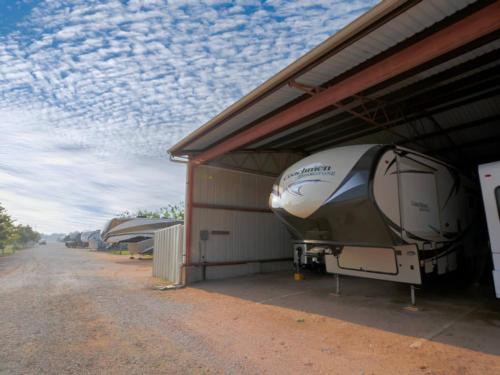 Covered parked trailer at site Miller Creek RV Park