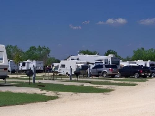 Parked RV's at Nueces River RV and Cabin Resort