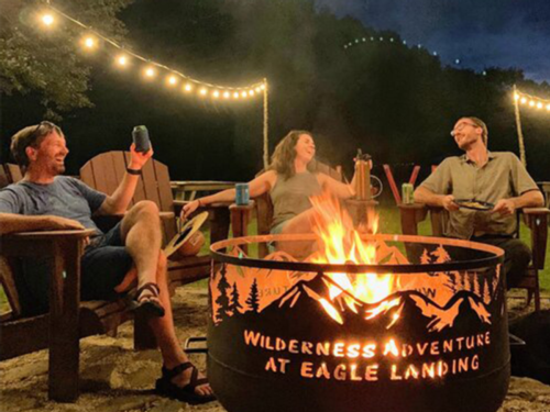 People around a firepit at Wilderness Adventure at Eagle Landing