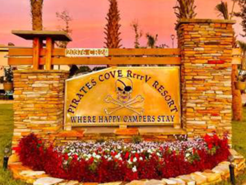 Front entrance sign at Pirate's Cove RrrrV Resort
