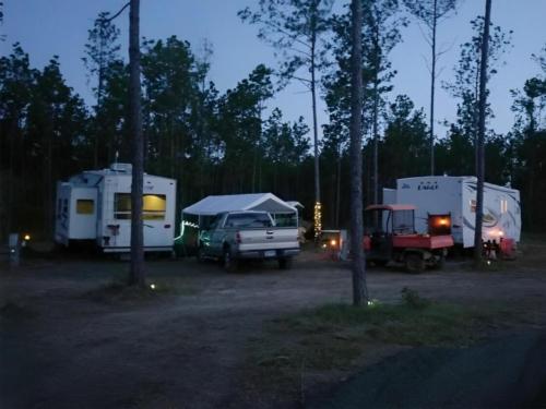 Parked RV's at site Blessing Trails RV Park