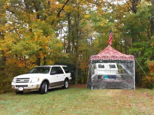 Trailer parked near trees at Blue Bear Mountain Camp