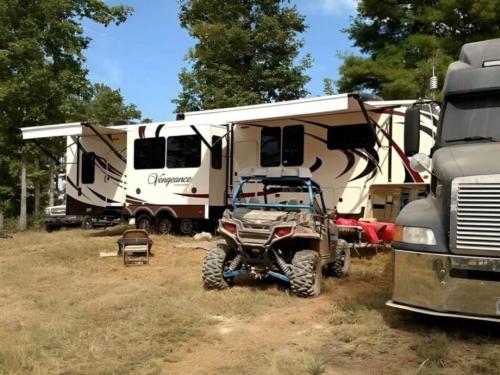 Parked RV and ATV in campsite