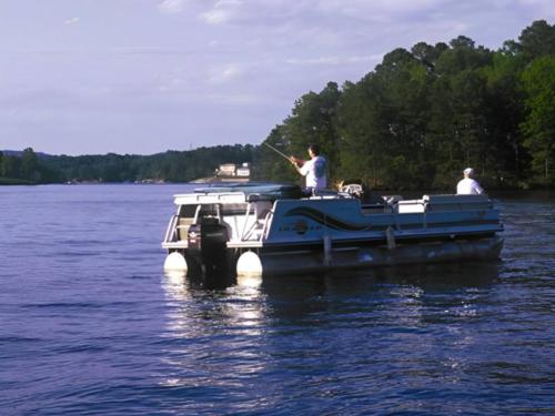 Boat on a lake at site Leisure Landing RV Park