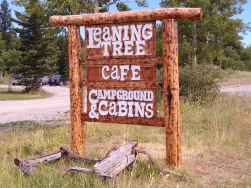 Rustic park sign at Leaning Tree Cafe and Campground