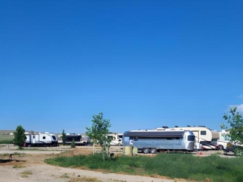 Parked trailers at site Crippled Spider RV Park & Campground