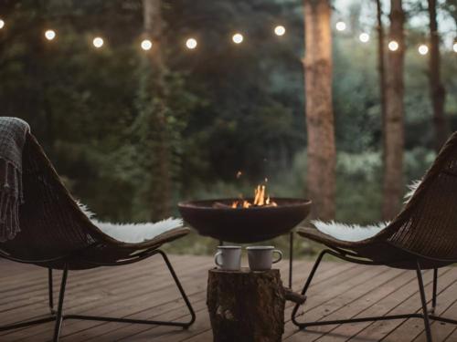 Fire pit with wood views at Red River Valley RV Park