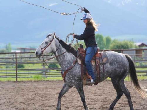 Person riding a horse at HAPI Trails Ranch