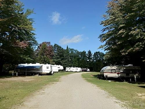 Parked travel trailers at The Woodlands Acres Campground