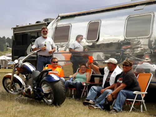 Folks hanging outside their Airstream trailer