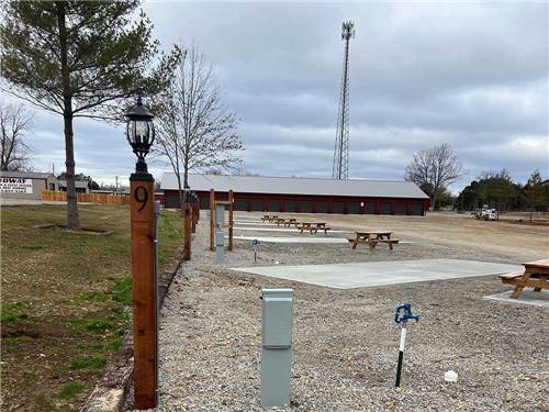A row of the paved RV sites at MIDWAY RV PARK AND CABIN RENTALS