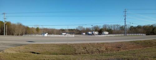 Travel trailers and fifth wheels parked at Sunset Ridge RV Park