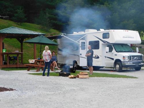 People visiting outside their RV