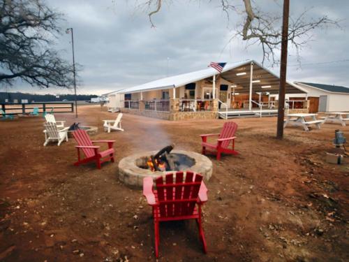 Fire pit with seating area at Lake Palo Pinto RV Park