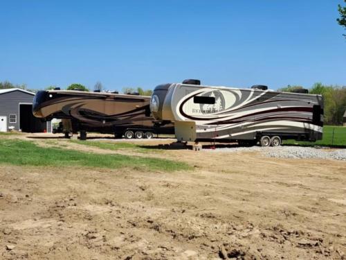 Parked trailers at site Country Life RV Parks and Services