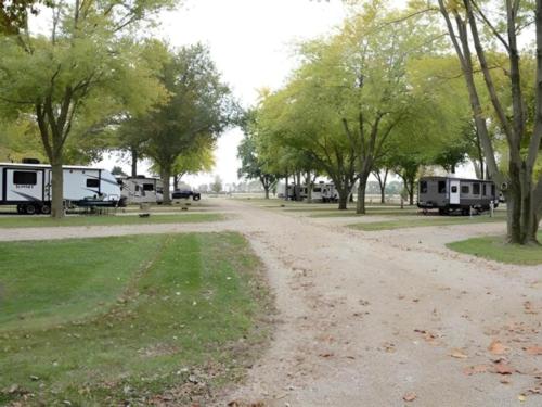 Open RV spaces next to parked trailers at Hartman Center Campground