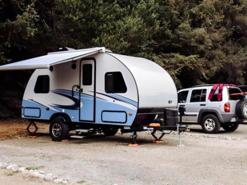 Parked trailer at site The Lamp Camp