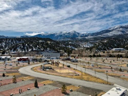 View of park and snow covered mountains Salida RV Resort