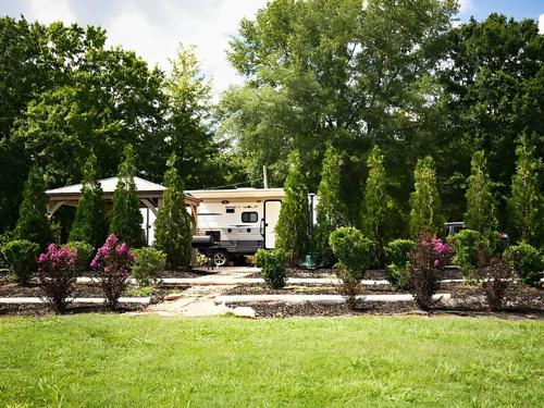 RV Site with trees at Time Away RV Resort