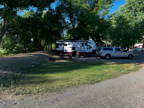 Trailers parked near bbq area at site Riverwood Resort on the Gunnison