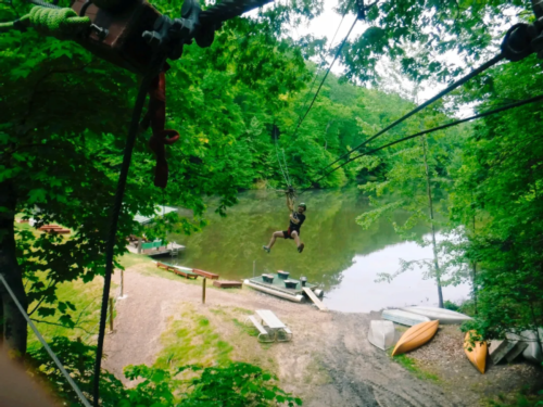 Ziplining over the water at eXplore Brown County