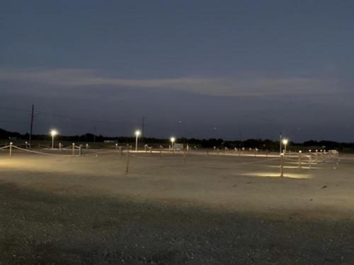 Open RV spaces with night time view at Inn and Out RV Park