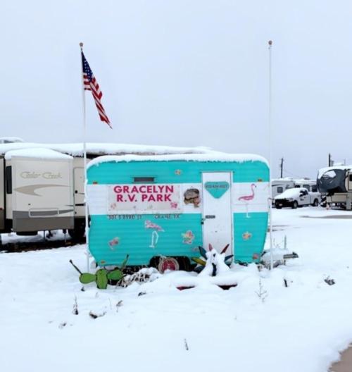 Camping trailer in the snow at Gracelyn RV Park