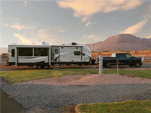 A travel trailer hitched to a truck