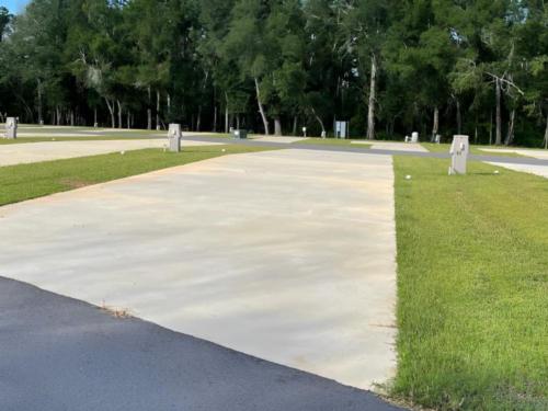 Paved open RV space at site Blue Heron Escape RV Resort