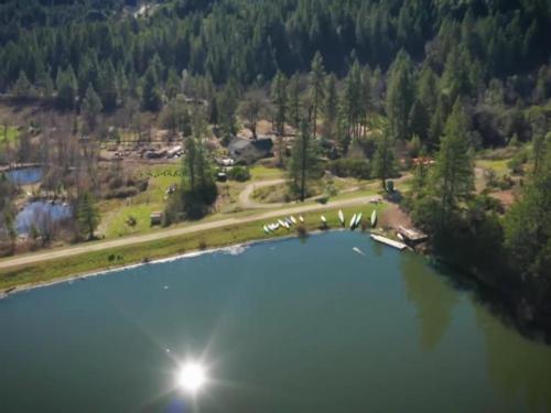 Aerial view of pond, kayaks and trees at Mendocino Magic