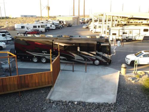 Big rig and other RVs nearby at NOMADLAND RV STAY