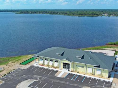 Aerial of exterior building and lake at WATERSIDE RV RESORT