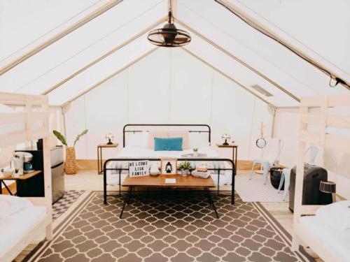 Bed inside glamping tent at Timberline Glamping at Lula