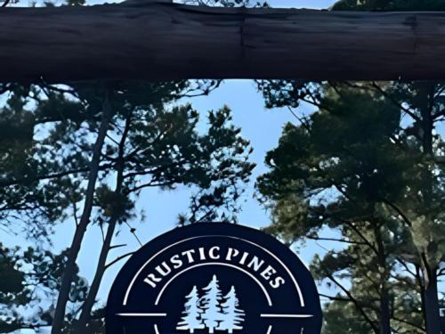 Welcome sign at site Rustic Pine RV Park 55+
