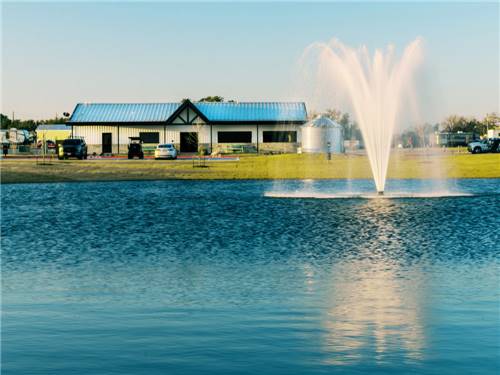 The pond fountain and office in the distance at LHTX RV Resort