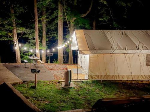 Night time look at a glamping tent at 	Timberline Glamping at Cheaha State Park