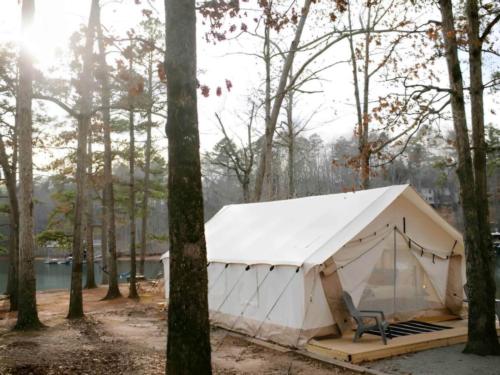 Side view of tent with lake in the back at Timberline Glamping at Williamsburg