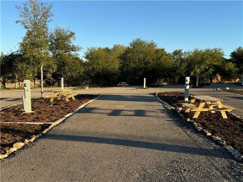 A gravel site with picnic table