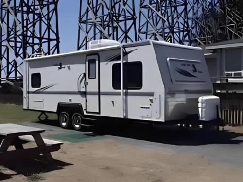 Trailer parked in a site by the bridge